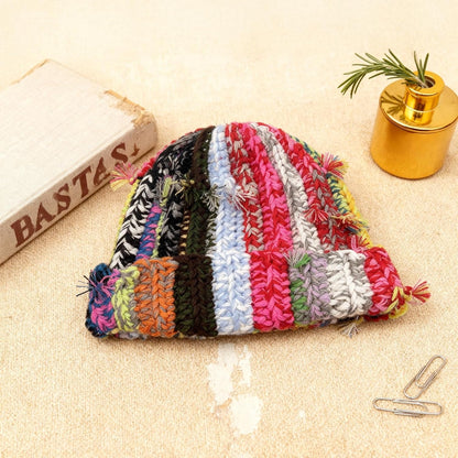 Womens Chunky Crochet Beanie Casual Cuffed Winter Hat with Boho Tassel Knot